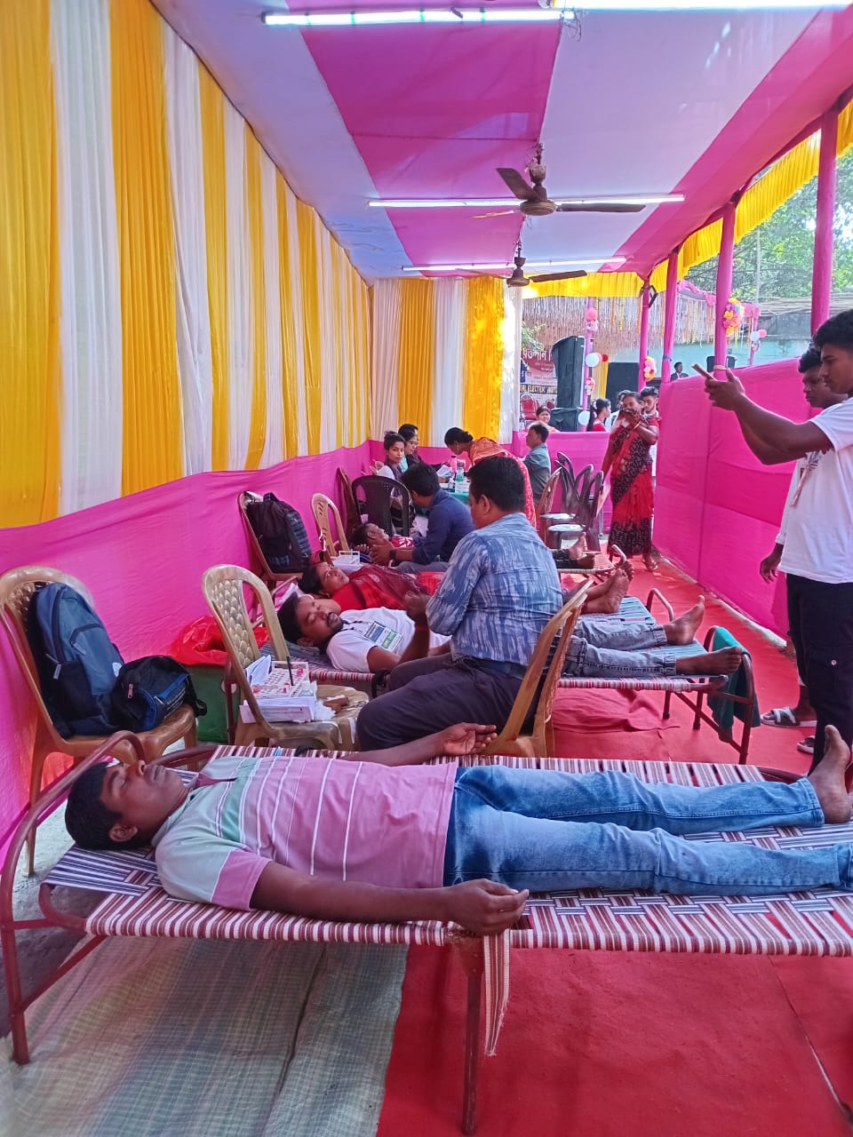 Phlebotomist prepping the arm — antiseptic wipe, vein found. — Aminpur blood donation camp