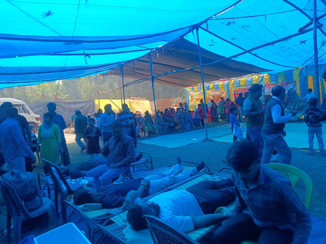 Anubhav CMC desk running back-to-back screenings — sugar, hemoglobin, BIA for every donor in queue. — Santoshpur blood donation camp