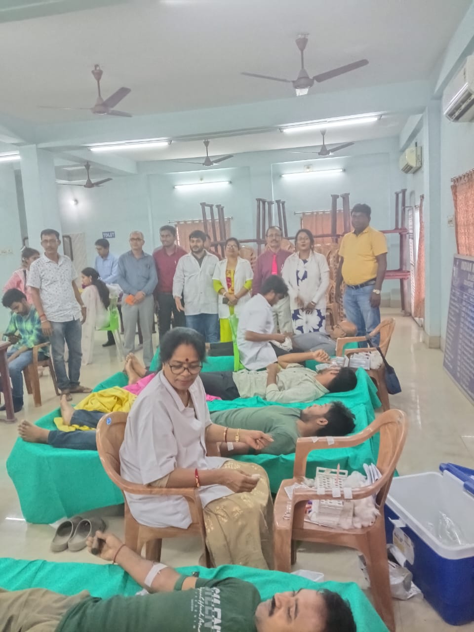 Quiet stretch of the camp — three beds in parallel, all running smoothly. — Guma blood donation camp