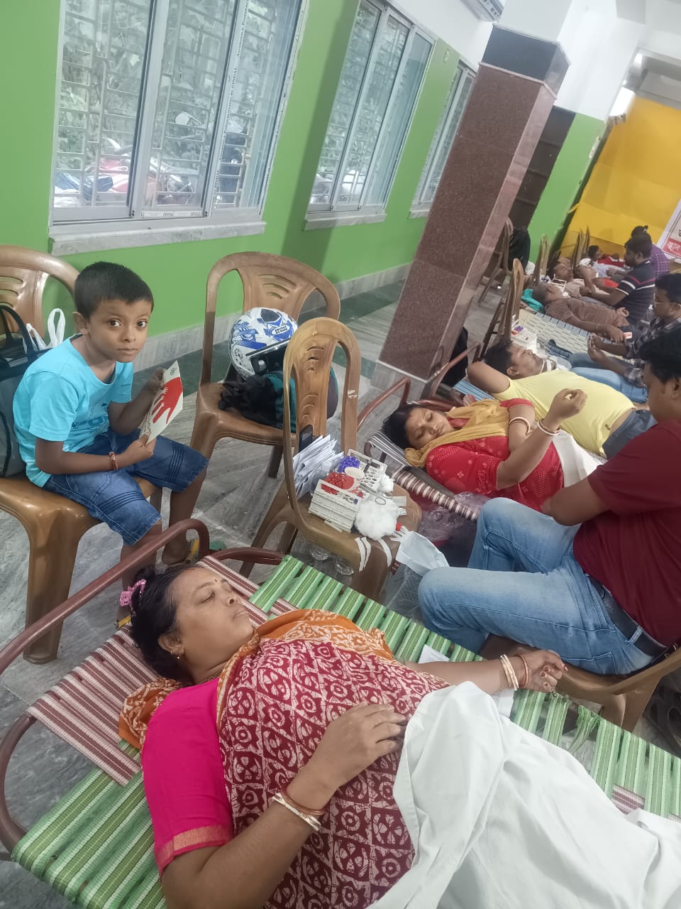 Phlebotomist prepping the arm — antiseptic wipe, vein found. — Duttapukur blood donation camp
