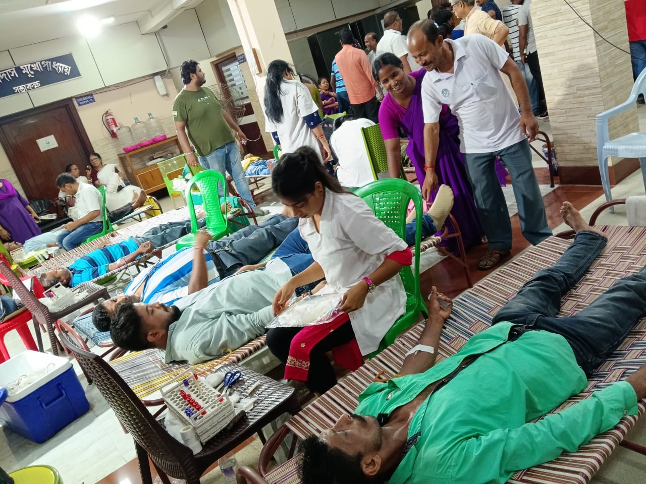 Post-donation rest with juice and a quiet sit-back. — Habra blood donation camp