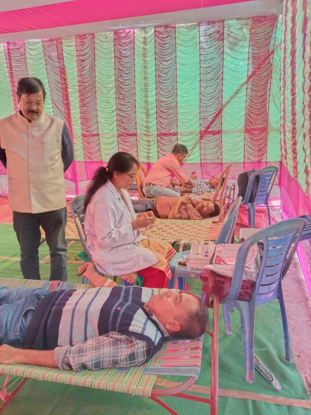 Donor finishing screening — sugar normal, hemoglobin cleared, on to the bed. — Ranaghat blood donation camp