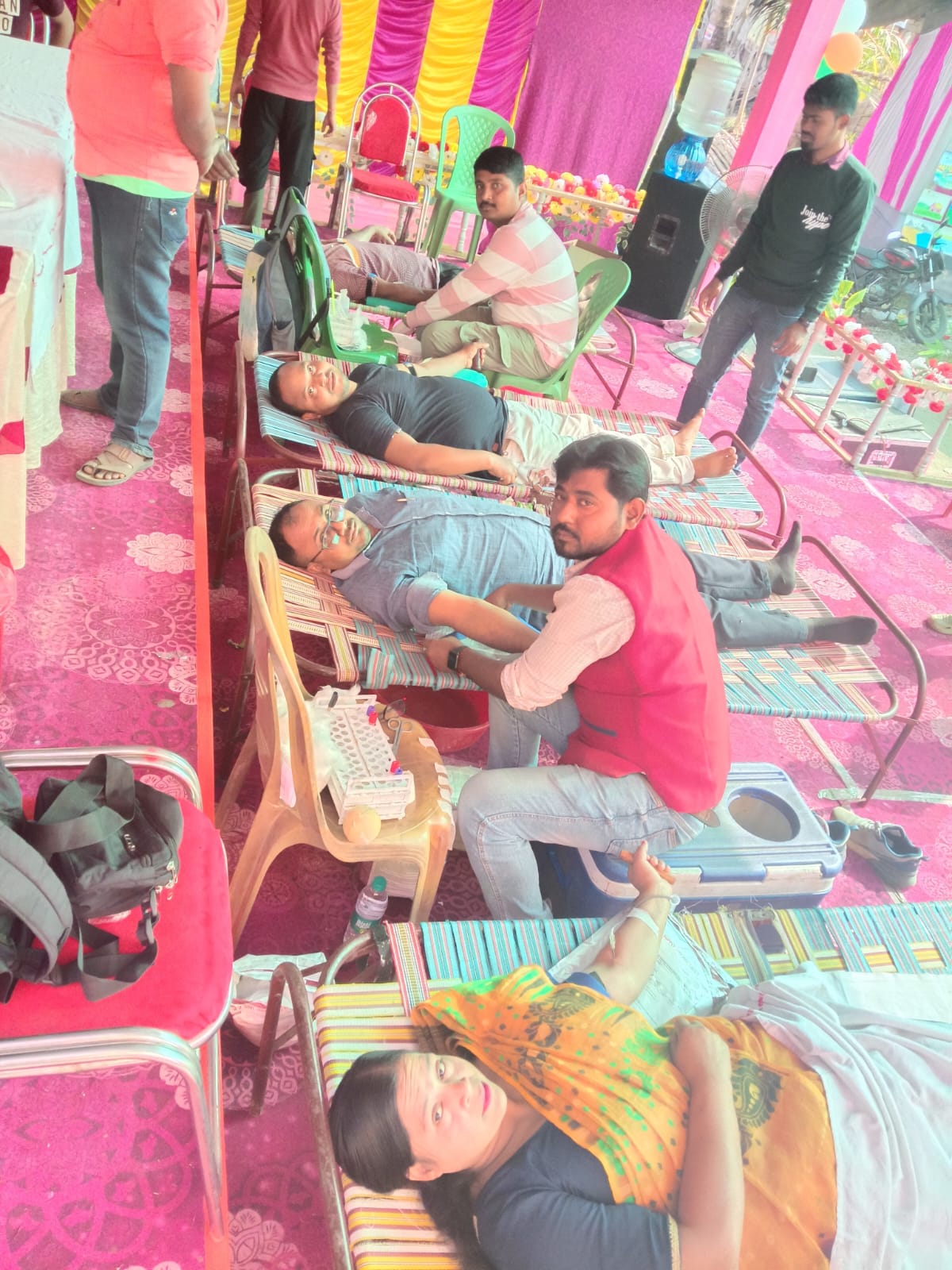 Documentation under way — donor logs, screening sheets, post-donation slips. — Deganga blood donation camp