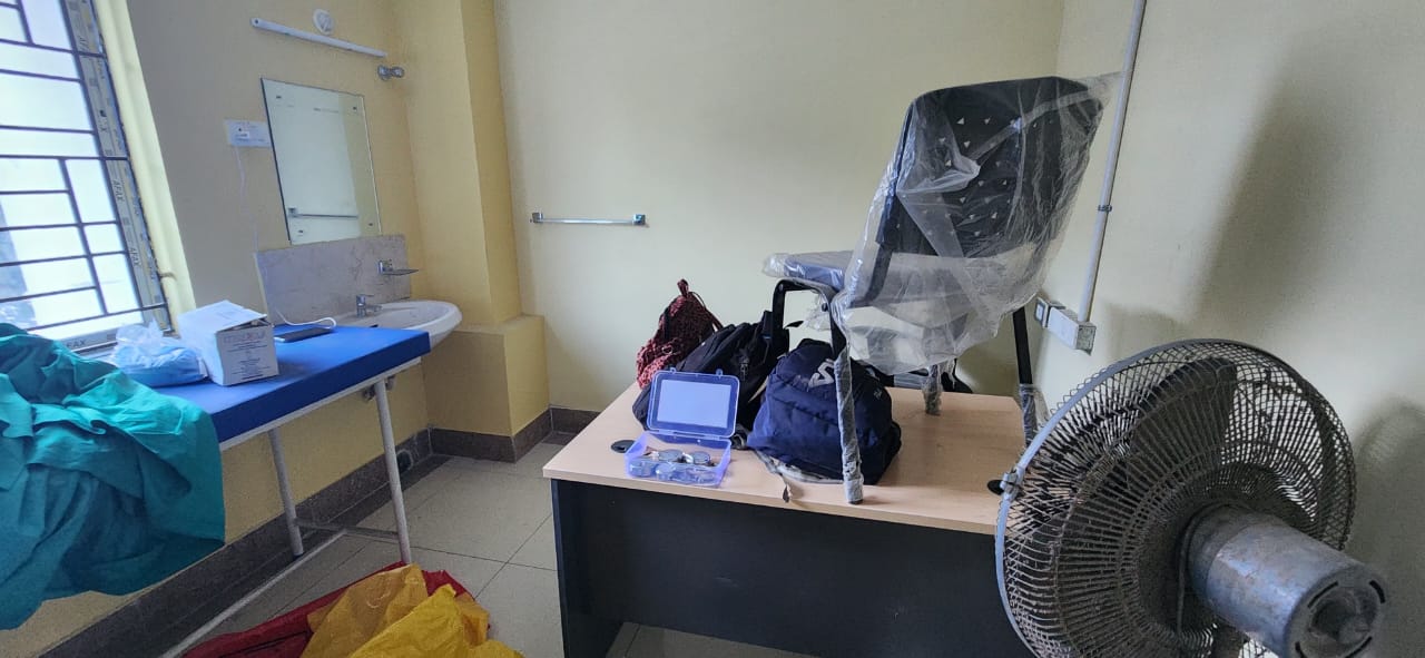 End of the bag — clamp going on, gauze ready, donor about to sit up. — Bira blood donation camp