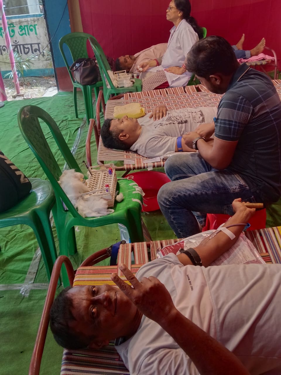 Team huddle before doors open — bed count, screening flow, who is at which station. — Badu blood donation camp