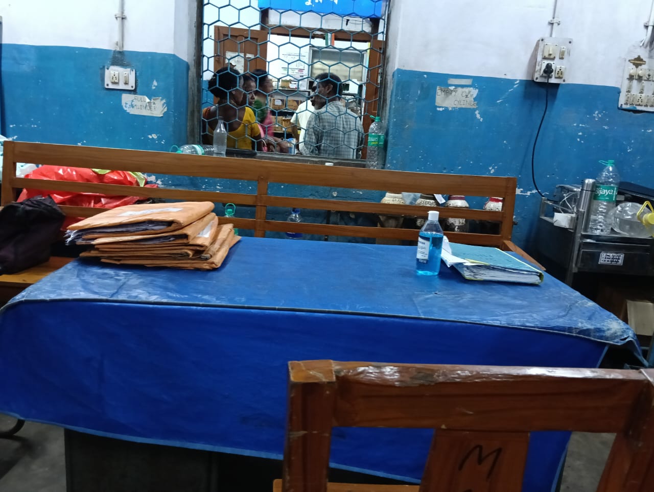 Pre-donation screening at the Anubhav CMC counter — fasting/random sugar from a single fingerprick. — Badu blood donation camp