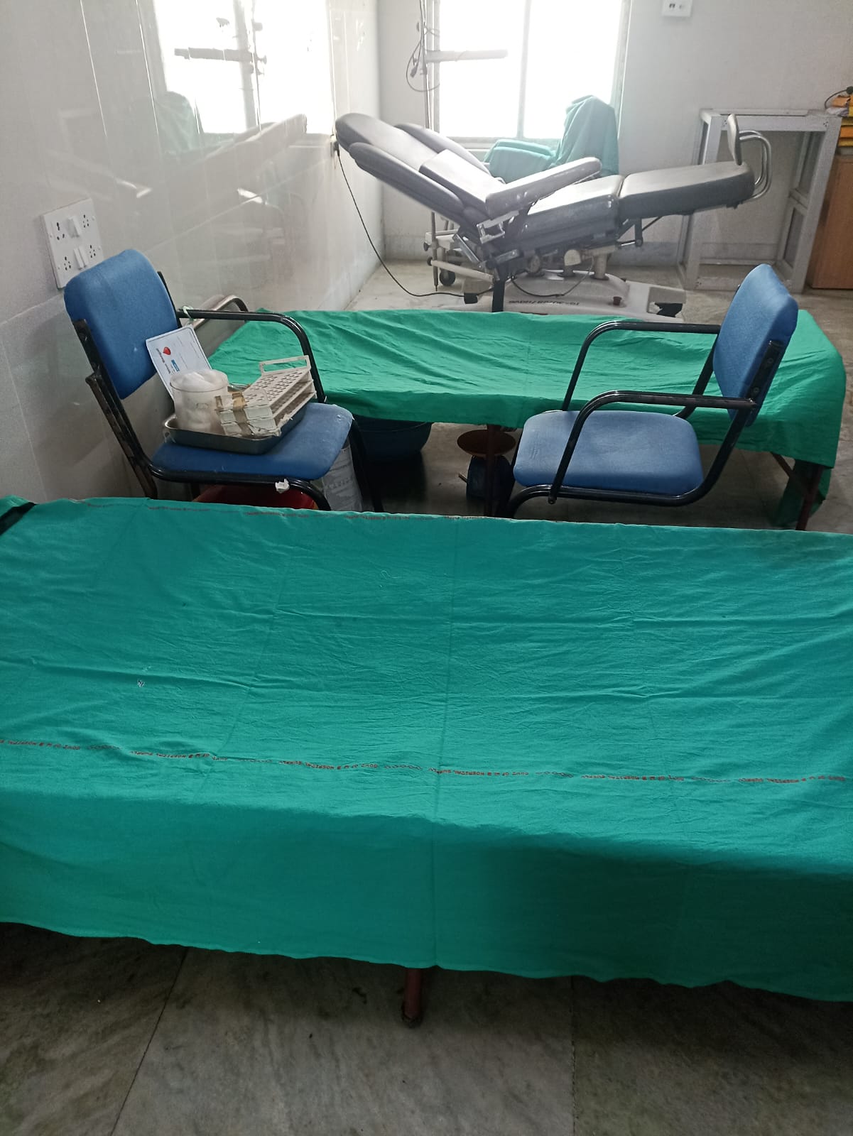 Quiet stretch of the camp — three beds in parallel, all running smoothly. — Barasat blood donation camp