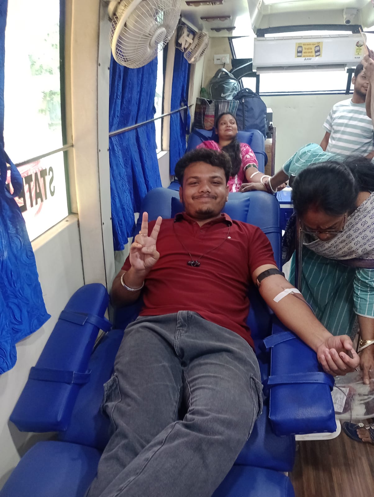 Post-donation rest with juice and a quiet sit-back. — Ghola blood donation camp